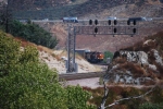 BNSF 7912 works her way around the bend rolling south with a vehicle train.